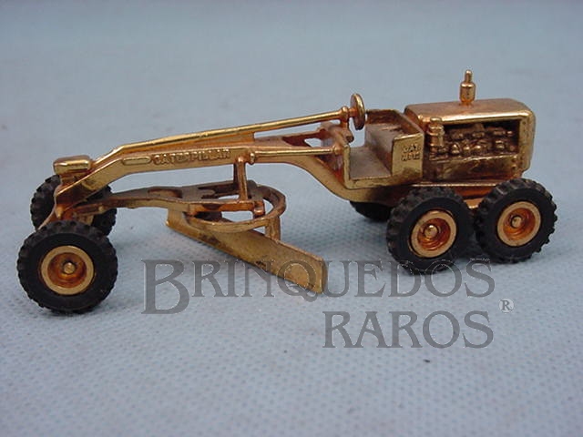 Brinquedo antigo Motoniveladora Caterpillar CAT 12 com 10,00 cm de comprimento folheada a ouro Década de 1970