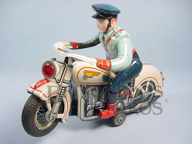 Brinquedo antigo Motocicleta de Polícia Atom Police Motorcycle com 30,00 cm de comprimento O Policial monta e desmonta da moto Década de 1960