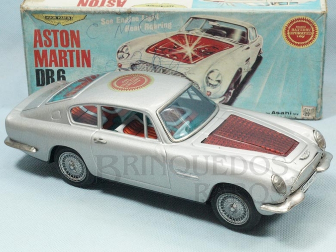 Brinquedo antigo Aston Martin DB6 motor iluminado Sistema Bate e  Volta 28,00 cm de comprimento Década de 1970

