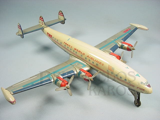 Brinquedo antigo Avião Super Constellation Trans Word Airlines fabricado pela Alps Japão em lata com 45,00 cm de envergadura Motor à corda anda e movimenta as hélices Década de 1960