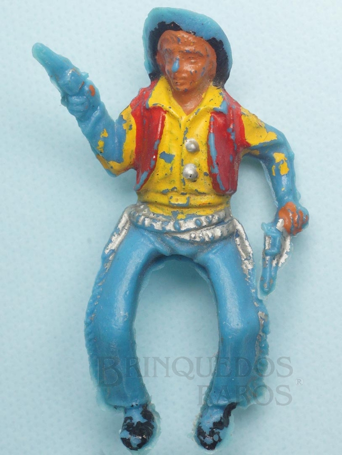 Brinquedo antigo Cowboy montado a cavalo com dois revolveres Plástico azul pintado Década de 1960