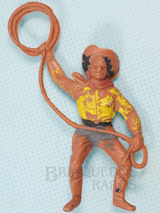 Brinquedo antigo Cowboy montado a cavalo com laço