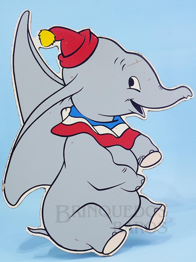 Brinquedo antigo Enfeite de parede Personagem Dumbo do Desenho Animado Dumbo o Elefante Voador com 28,00 cm de altura impressão manual em Duratex sob Licença Walt Disney Década de 1960