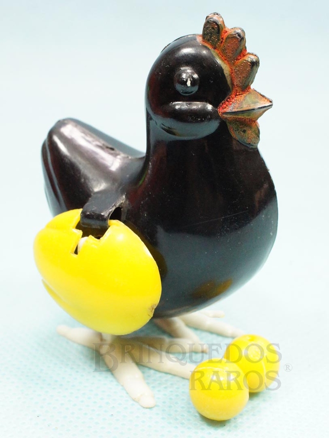 Brinquedo antigo Galinha que põe ovos 7,50 cm de altura Década de 1960