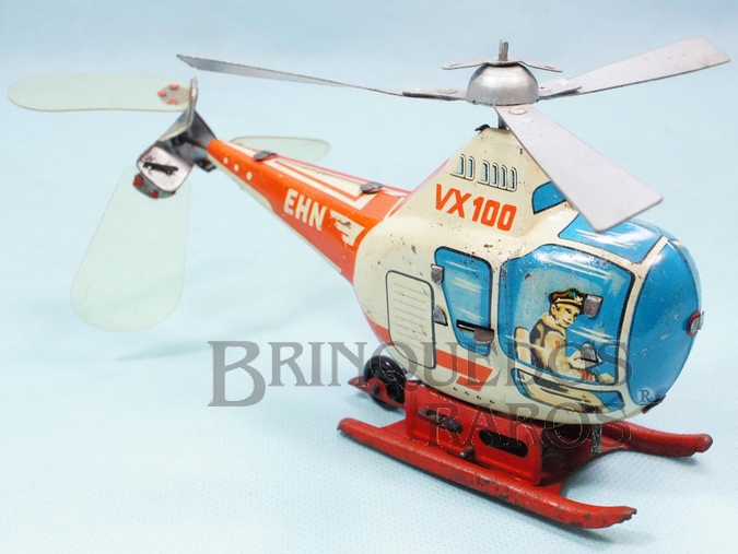 Brinquedo antigo Helicóptero VX 100 com 17,00 cm de comprimento Anda para a frente e pode voar preso por um fio ao teto Década de 1960