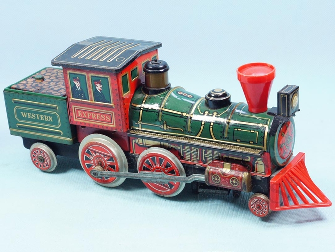 Brinquedo antigo Locomotiva Western Express com 37,00 cm de comprimento Apresenta o vagão de carvão incorporado Fabricada pela Modern Toys Japão em lata Motor à pilha Sistema Bate e Volta com som de apito e chaminé iluminada Década de 1950